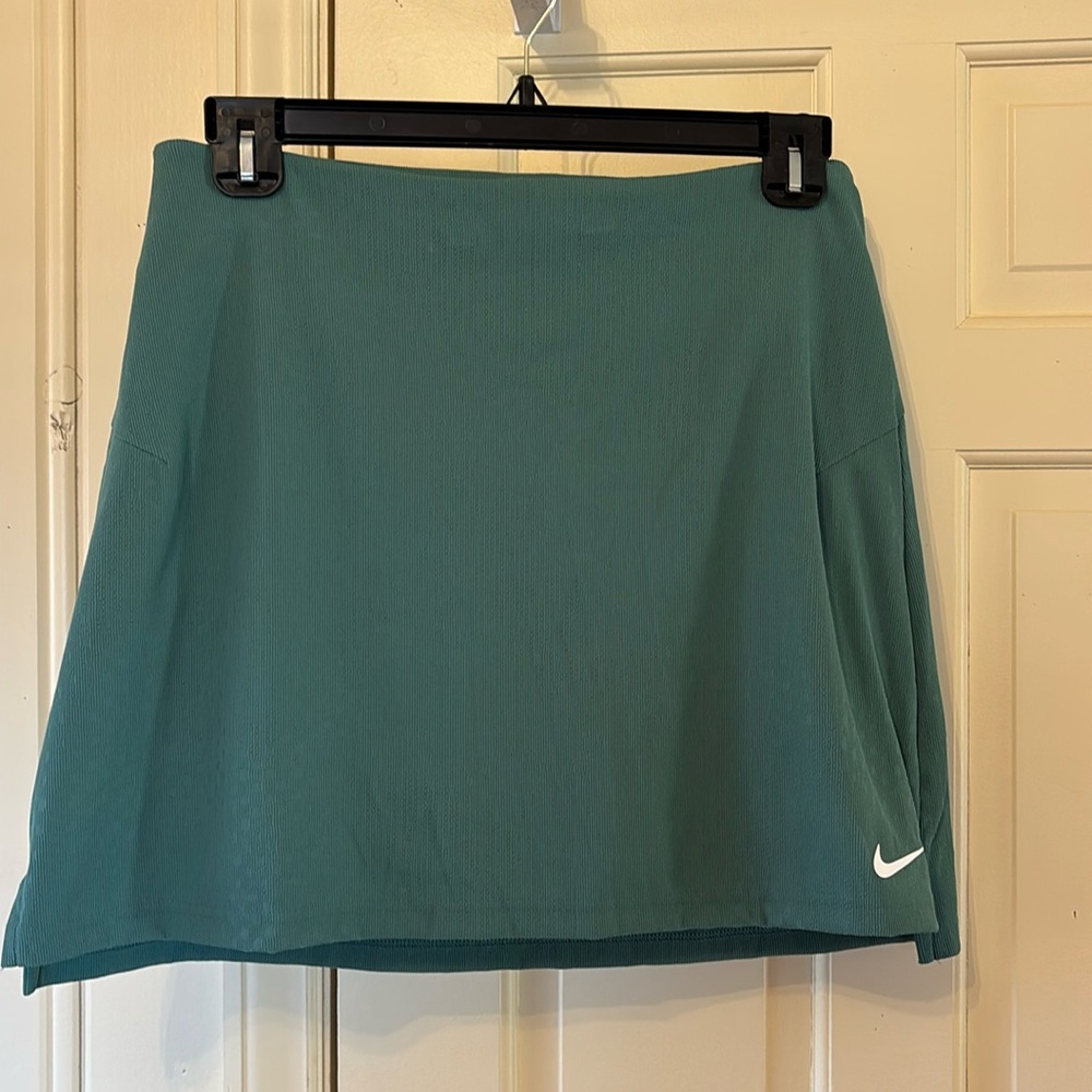 New without Tags Nike skort, with biker shorts/pocket! Size Large